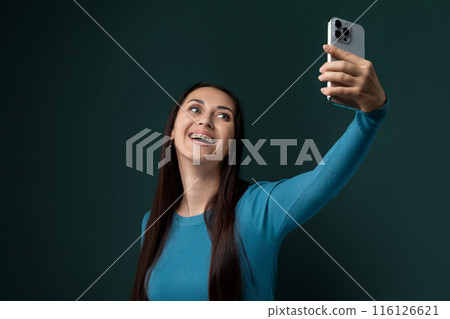 Woman Taking a Selfie With Her Cell Phone Woman Taking a Selfie With Her Cell Phone 116126621