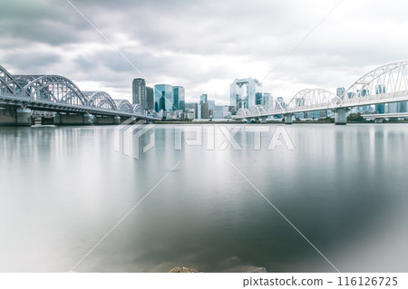 Skyscrapers reflected in the river Skyscrapers reflected in the river 116126725