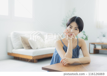 Woman in blue camisole 116126869
