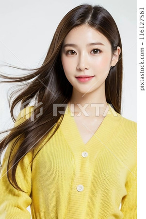 Two young women working in an office 116127561