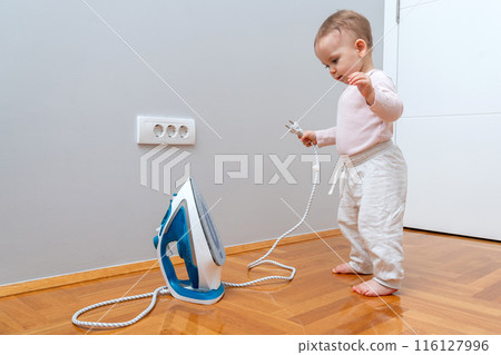 Baby and the House Iron. Concept of Dangerous Things for Children 116127996