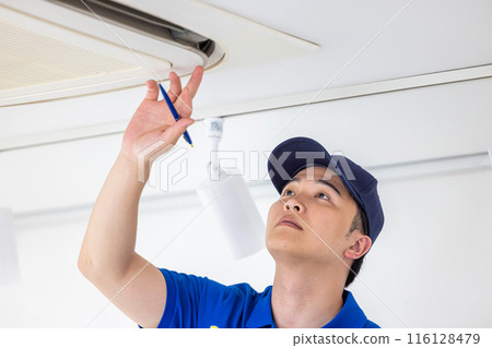 Workers inspecting air conditioners 116128479