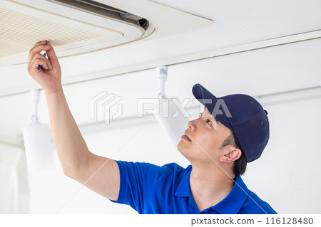 Workers inspecting air conditioners Workers inspecting air conditioners 116128480