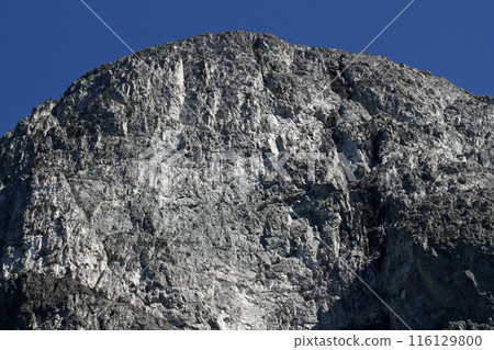 Cliff rocks of a Norwegian fjord Cliff rocks of a Norwegian fjord 116129800
