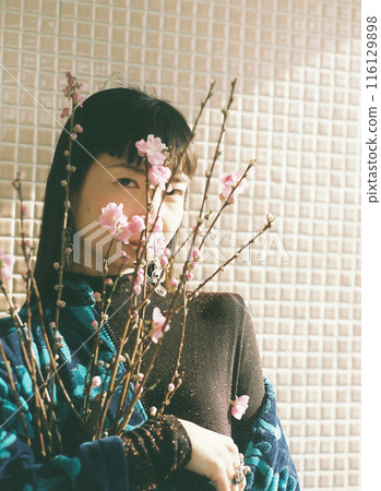 A woman with a cherry petal A woman with a cherry petal 116129898