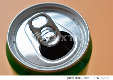 aluminum green drink cans on orange background, open cold fresh beverage aluminum green drink cans on orange background, open cold fresh beverage 116130049