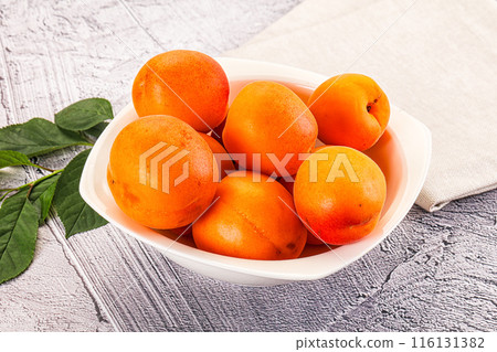 Raw ripe sweet apricots heap 116131382