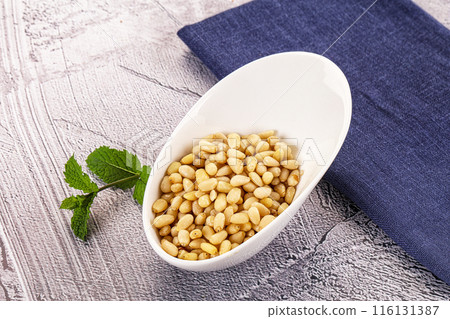 Peeled cedar nut in the bowl 116131387