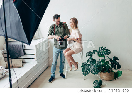 young cool girl rejoicing at good photos young cool girl rejoicing at good photos 116131900