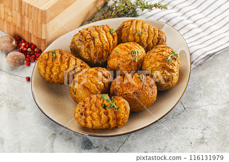 Baked baby potato with thyme Baked baby potato with thyme 116131979