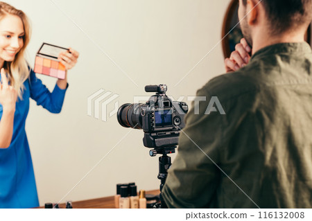 young man makking a film about foreign cosmetcs 116132008