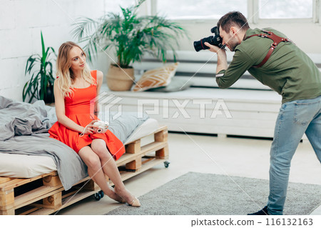 attractive fair-haired sexy girl looking at the photographer's camera 116132163