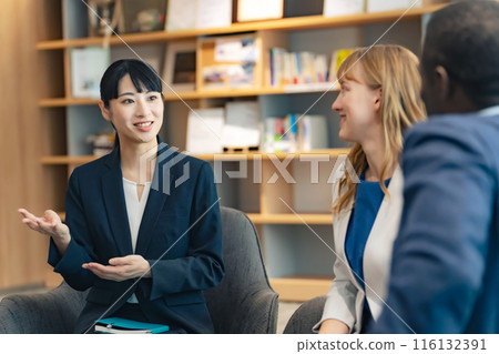 A group of multinational business people talking in a lounge A group of multinational business people talking in a lounge 116132391