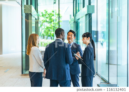 Group of multinational business people talking in a lobby 116132401