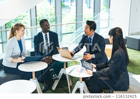 Group of multinational business people talking in a lobby 116132425