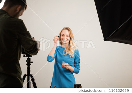 tretament concept. happy girl in stylish dress using the brush for skin tretament concept. happy girl in stylish dress using the brush for skin 116132659