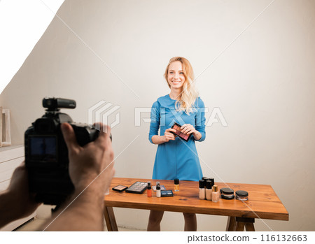 man reshooting the photo with a gorgeous girl man reshooting the photo with a gorgeous girl 116132663