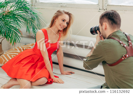 happy stylish romantic girl getting pleasure from photo session 116132692