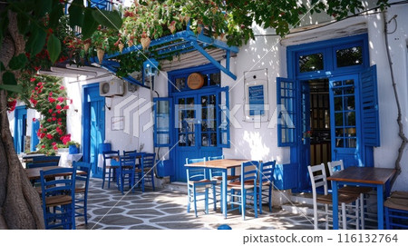 Greek cafe with blue chairs and floral decor 116132764