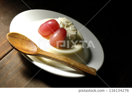 Panna cotta with cream and grapes 116134276