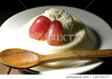 Panna cotta with cream and grapes 116134277