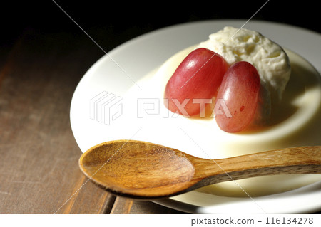 Panna cotta with cream and grapes 116134278