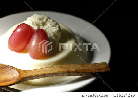 Panna cotta with cream and grapes 116134280
