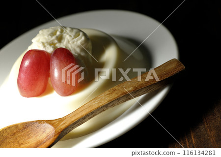 Panna cotta with cream and grapes 116134281