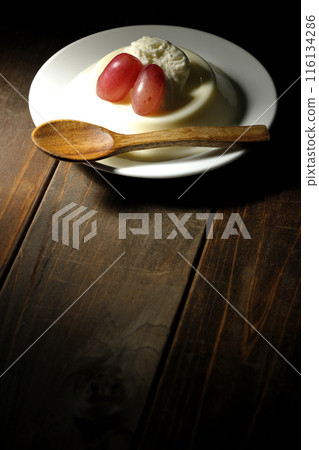 Panna cotta with cream and grapes 116134286
