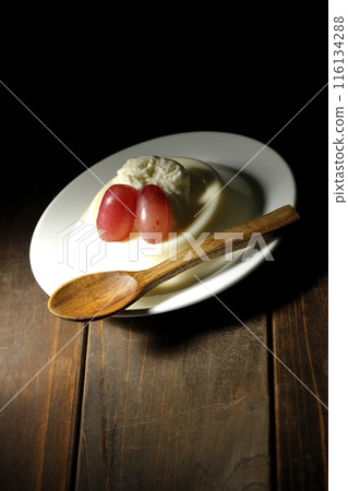 Panna cotta with cream and grapes 116134288
