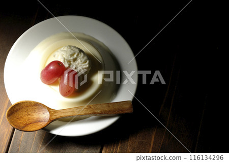 Panna cotta with cream and grapes 116134296