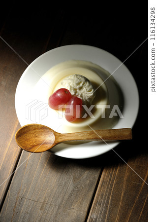 Panna cotta with cream and grapes 116134298