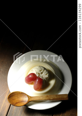 Panna cotta with cream and grapes 116134299