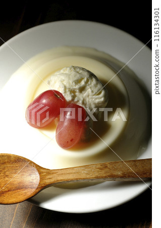 Panna cotta with cream and grapes 116134301