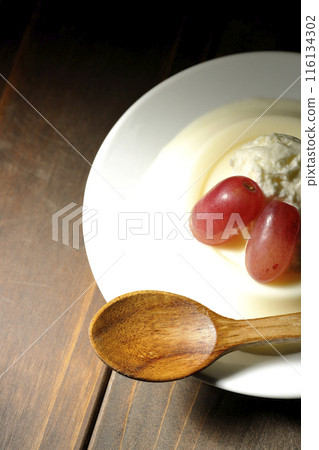 Panna cotta with cream and grapes 116134302