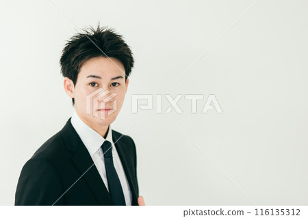 A young businessman with a smile A young businessman with a smile 116135312