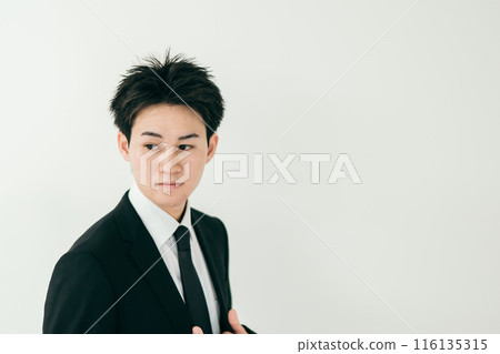 A young man in his 20s wearing a suit A young man in his 20s wearing a suit 116135315