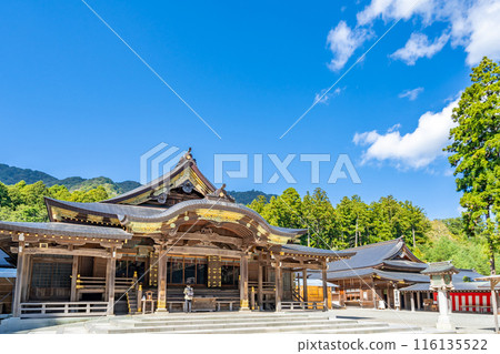 Echigo Ichinomiya Yahiko Shrine - Main Hall and Worship Hall, Sangensha Nagare-zukuri style with a veranda, set in a deep forest with Mt. Yahiko in the background 116135522