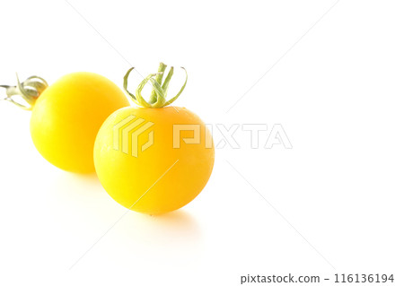 Yellow cherry tomatoes photographed on a white background Yellow cherry tomatoes photographed on a white background 116136194