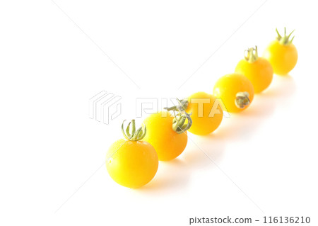 Yellow cherry tomatoes photographed on a white background Yellow cherry tomatoes photographed on a white background 116136210