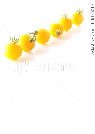Yellow cherry tomatoes photographed on a white background Yellow cherry tomatoes photographed on a white background 116136219