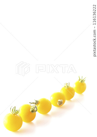 Yellow cherry tomatoes photographed on a white background Yellow cherry tomatoes photographed on a white background 116136222