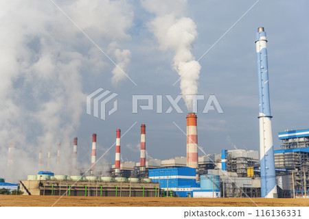Power stations manufacturing electrical industrial plant. Electric power building refinery engineering smog steam smokestack. Lignite electricity chimneys release pollution in industry plant blue sky 116136331