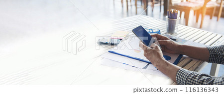 Banner woman working office desk reading financial report finance chart graph on table. Wide tax audit woman hands working paperwork office. Banner Businesswoman Audit financial with copy space Banner woman working office desk reading financial report finance chart graph on table. Wide tax audit woman hands working paperwork office. Banner Businesswoman Audit financial with copy space 116136343