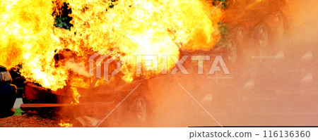 Firefighter Rescue training in fire fighting extinguisher. Firefighter fighting with flame using fire hose chemical water foam spray engine. Fireman wear hard hat, safety suit uniform for protection 116136360