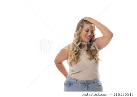 A Caucasian young female plus size model with long blonde hair on white background, copy space A Caucasian young female plus size model with long blonde hair on white background, copy space 116136515
