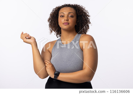 Biracial young female model poses on white background Biracial young female model poses on white background 116136606