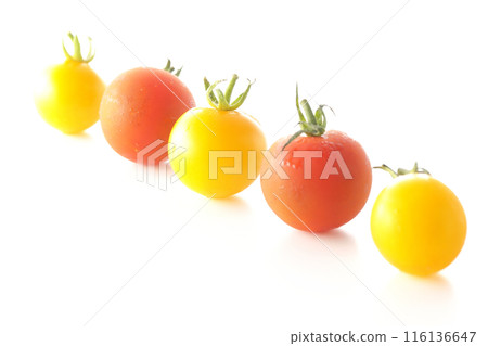 Yellow and red cherry tomatoes photographed on a white background Yellow and red cherry tomatoes photographed on a white background 116136647