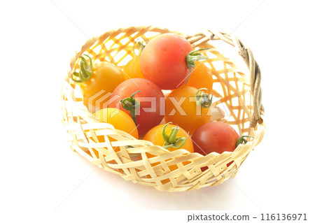 A bamboo basket full of yellow and red cherry tomatoes photographed on a white background A bamboo basket full of yellow and red cherry tomatoes photographed on a white background 116136971