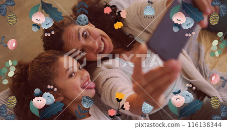 Image of colourful flowers over mother and daughter making faces, taking selfies with smartphone 116138344